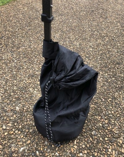 how to anchor a canopy on concrete - a canopy weight bag attached to a pole