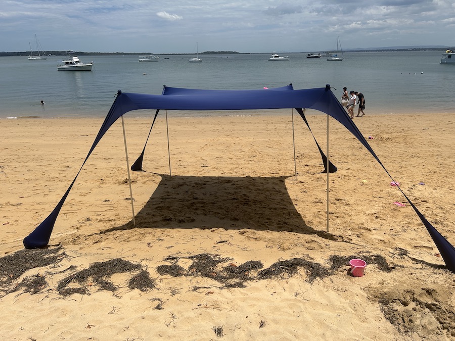sun ninja review - photo of a blue shelter on a beach